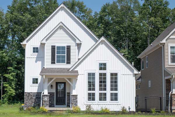 Cottage house with 1st floor primary bedroom house plan